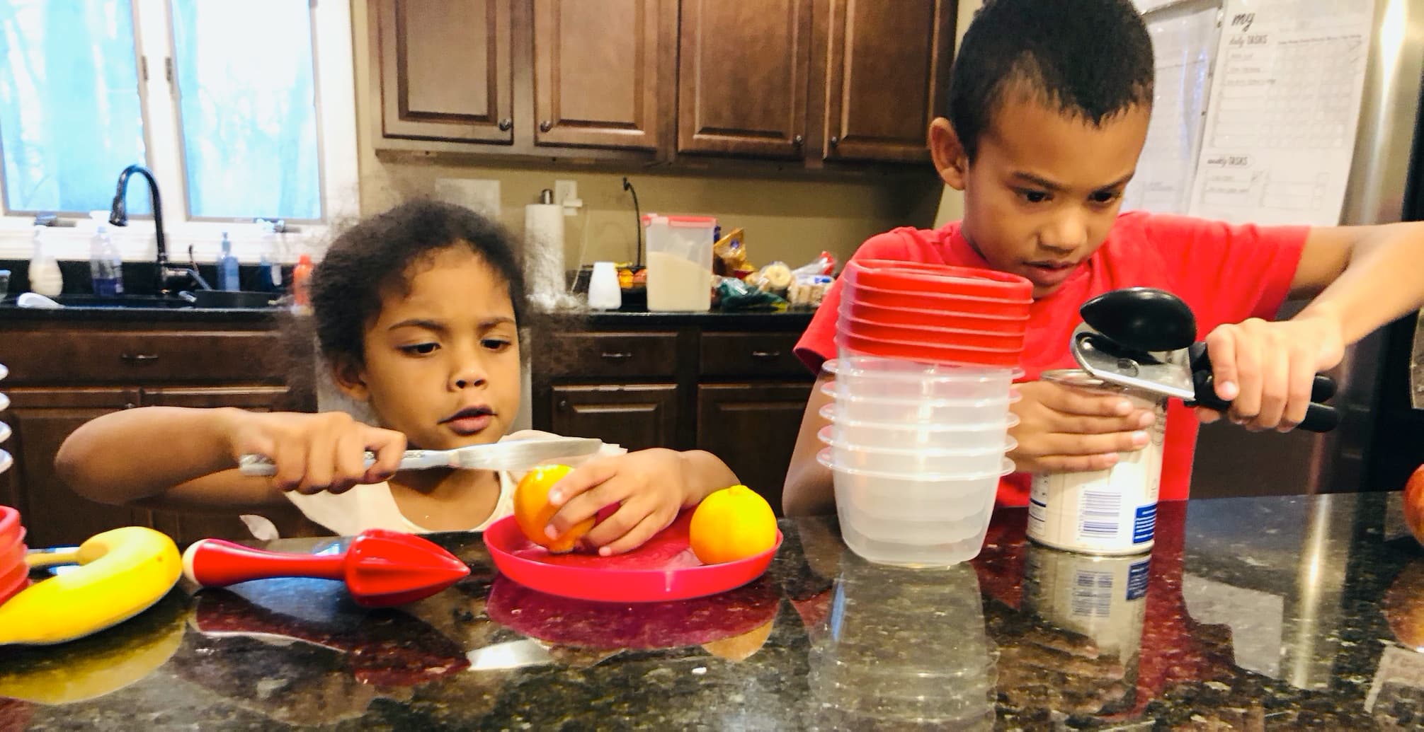 Kids making fruit salad